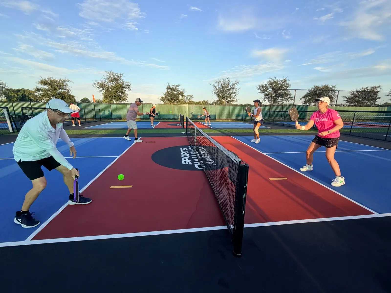 UPA clinic participants practicing together across the net